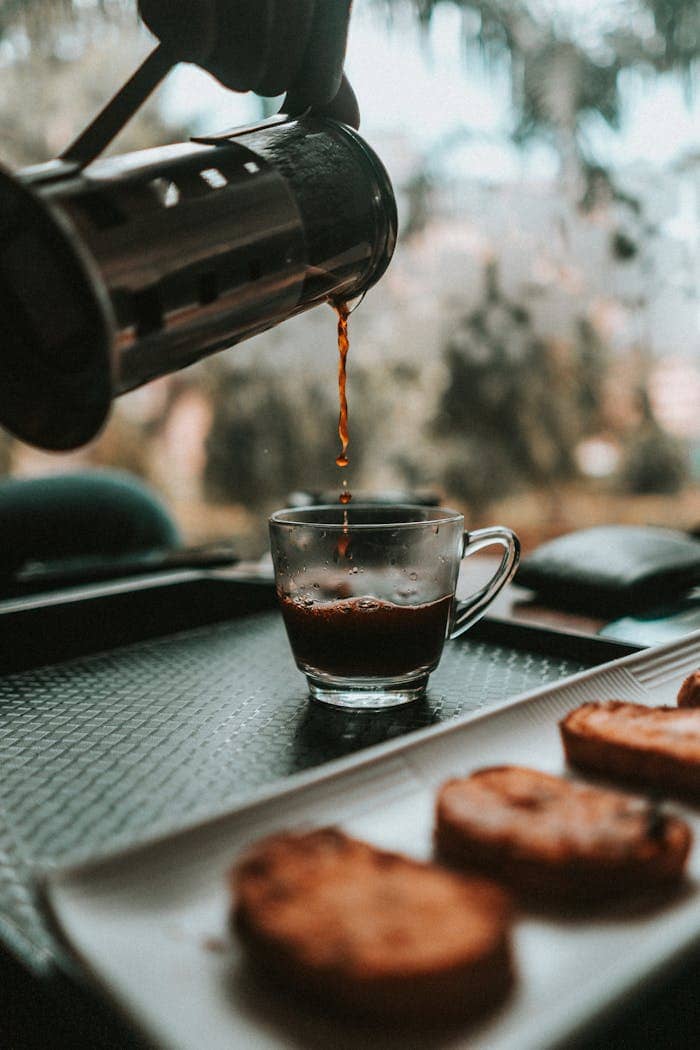 Pouring Coffee In Clear Glass Mug